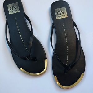 Dolce Vita black with gold trim flip flops